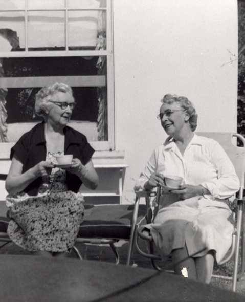 Lucy Miller Healy, left, and her sister Ethel Miller Boyd, drinking tea, 1957.